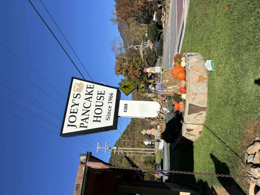 The Joey’s Pancake House road sign decorated with pumpkins and hay bales near Maggie Valley NC